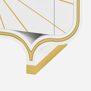 Close-up of a white and gold 4-door buffet leg on a white background.